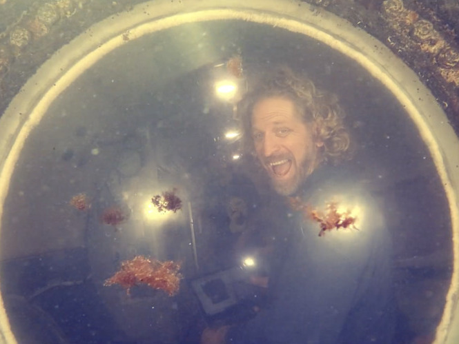 caption: Joseph Dituri lives in a 100-square-foot bunker, about the size of two king beds, that includes a small kitchen, living room and sleeping area.