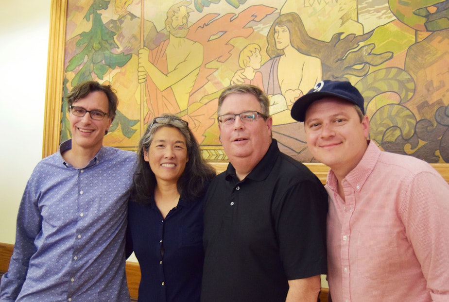 caption: Bill Radke, Deb Wang, Chris Vance and Luke Burbank at the Leif Erikson Lodge as part of the 'Week in Review' summer tour.