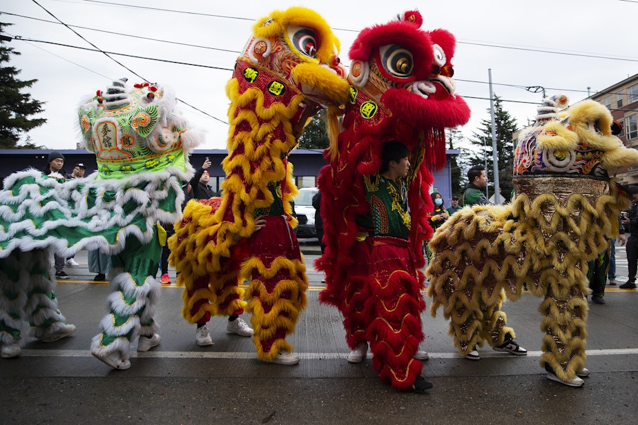 caption: Mak Fai Dragon and Lion dancers, including Ethan Lee, 19, perform during the Lunar New Year celebration on Saturday, Feb. 4, 2023, in Seattle’s Chinatown-International District. 