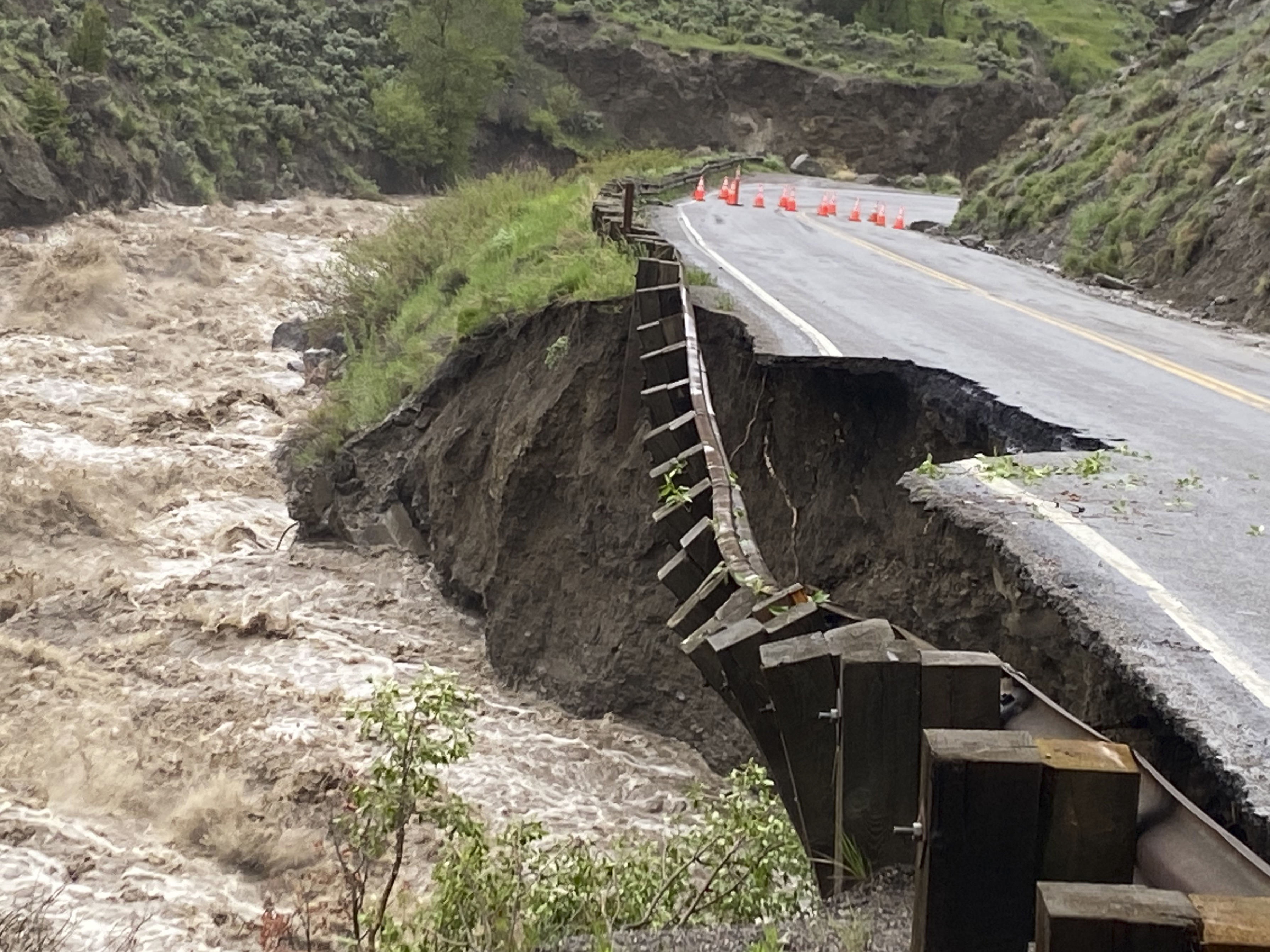 caption: High water in the Gardiner River along the North Entrance to Yellowstone National Park in Montana washed out part of a road on Monday.