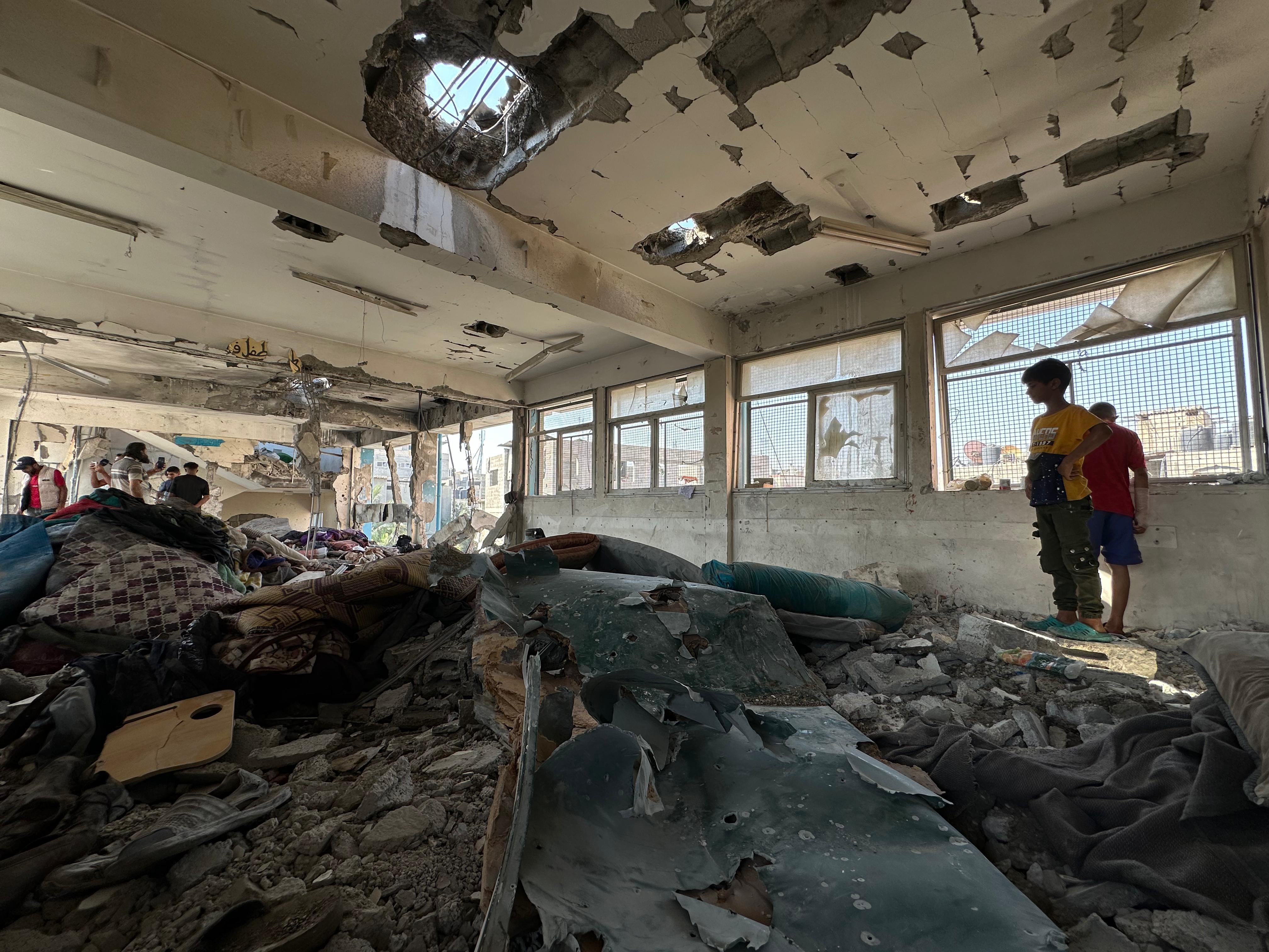 caption: The aftermath of an Israeli strike on a U.N. school compound in Nuseirat, in the central Gaza Strip, that killed more than 30 people, including children, according to a Gaza hospital director. Israel said it was targeting Hamas and Islamic Jihad operatives hiding in two school classrooms.