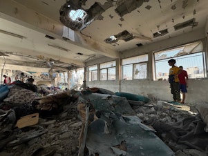 caption: The aftermath of an Israeli strike on a U.N. school compound in Nuseirat, in the central Gaza Strip, that killed more than 30 people, including children, according to a Gaza hospital director. Israel said it was targeting Hamas and Islamic Jihad operatives hiding in two school classrooms.