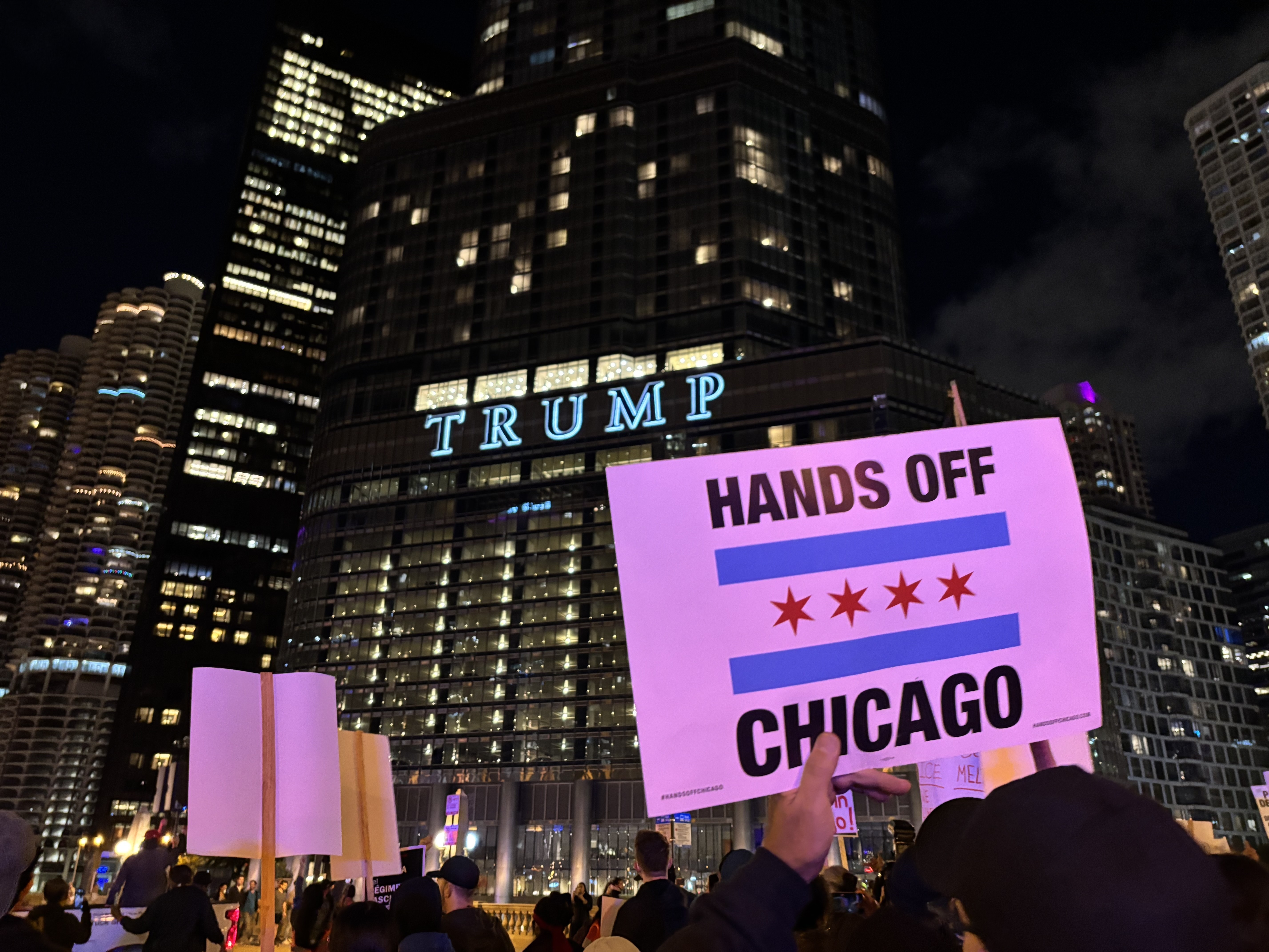 caption: Hundreds marched in downtown Chicago on Oct. 8, protesting President's Trump deployment of National Guard troops and the presence of immigration enforcement agents in the city.