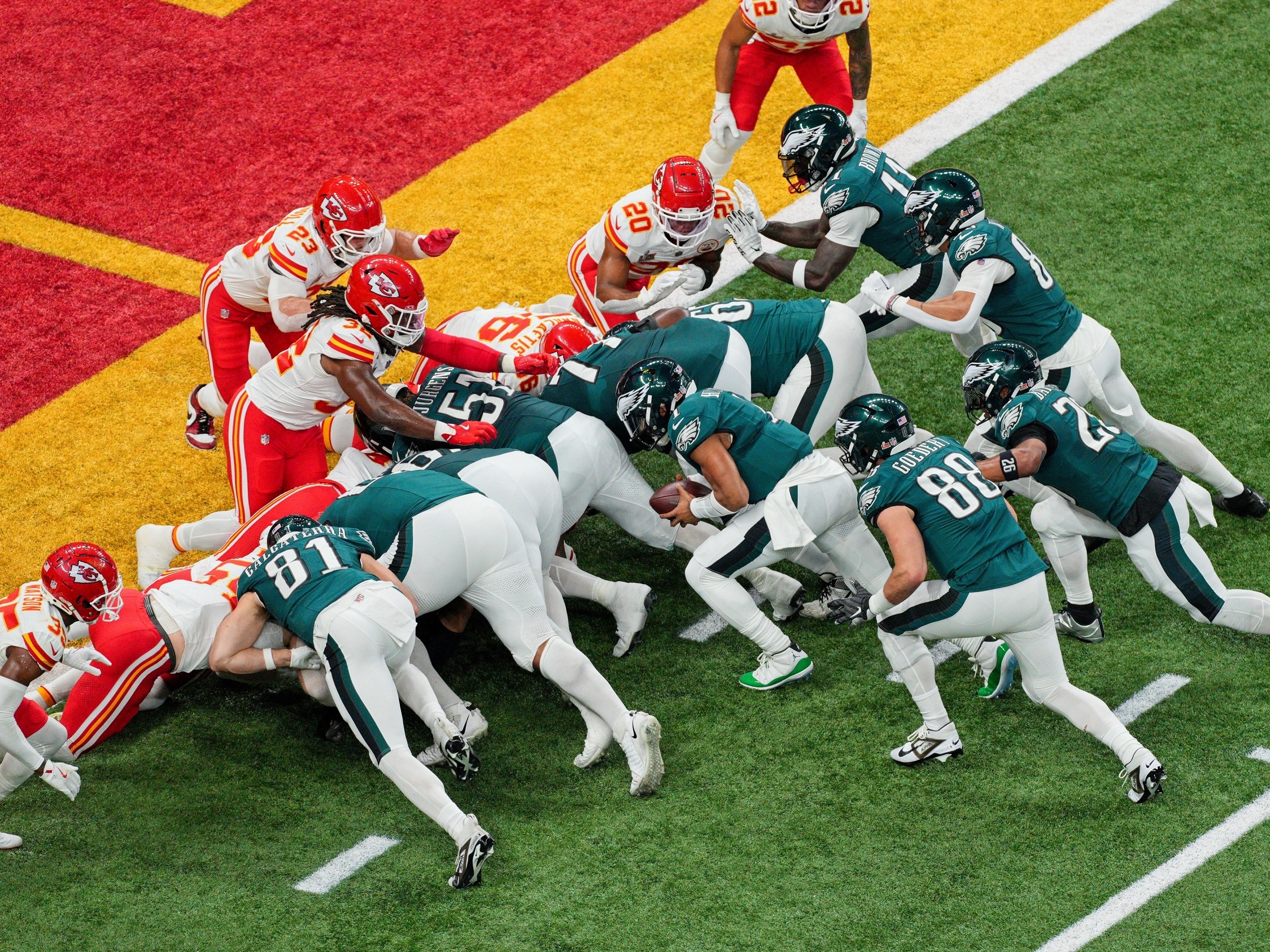 caption: Philadelphia Eagles quarterback Jalen Hurts scores a touchdown on a tush push during Super Bowl LIX against the Kansas City Chiefs in February.