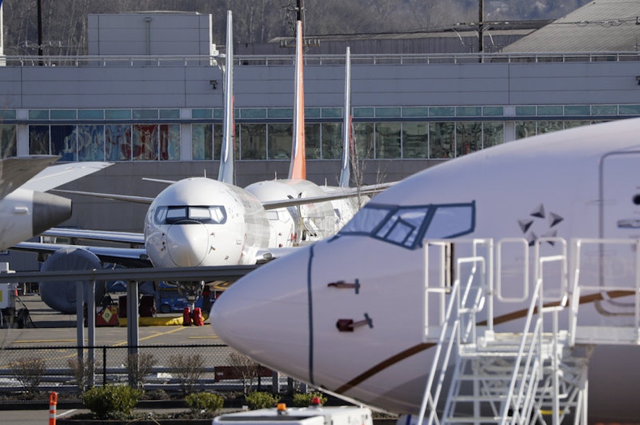 caption: Grounded Boeing 737 Max airplanes fill a parking area adjacent to Boeing Field in Seattle on Feb. 19, 2020. 