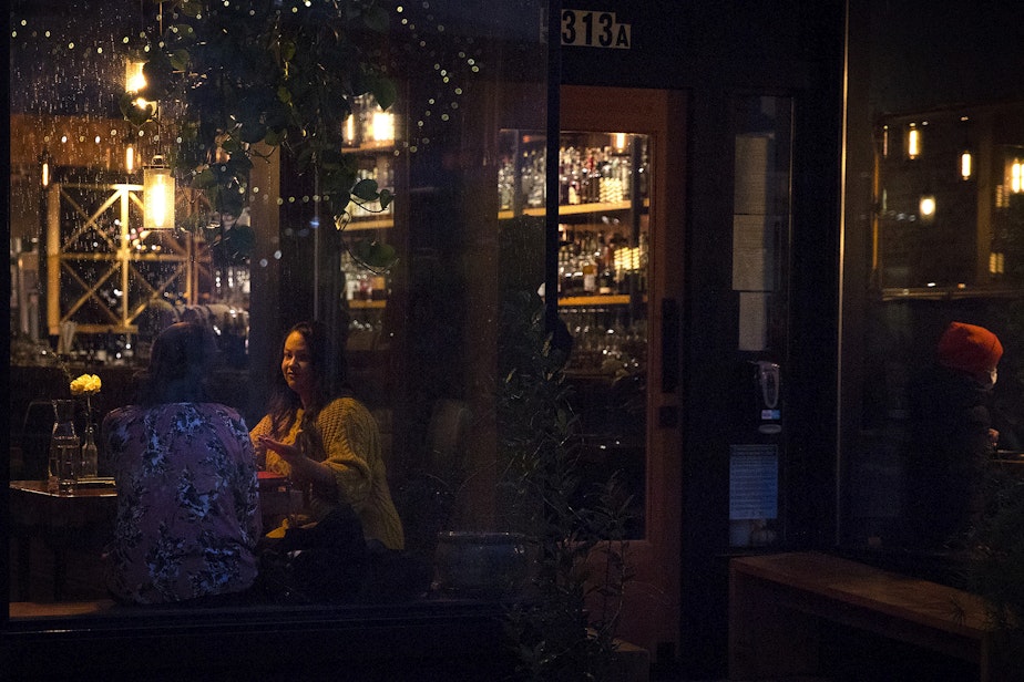 caption: Guests are shown dining inside of Gracia on Monday, November 16, 2020, along Ballard Avenue Northwest in Seattle. New statewide restrictions, including a ban on indoor dining beginning Wednesday, were announced by Gov. Jay Inslee on Sunday to curb the rapid spread of Covid-19. 