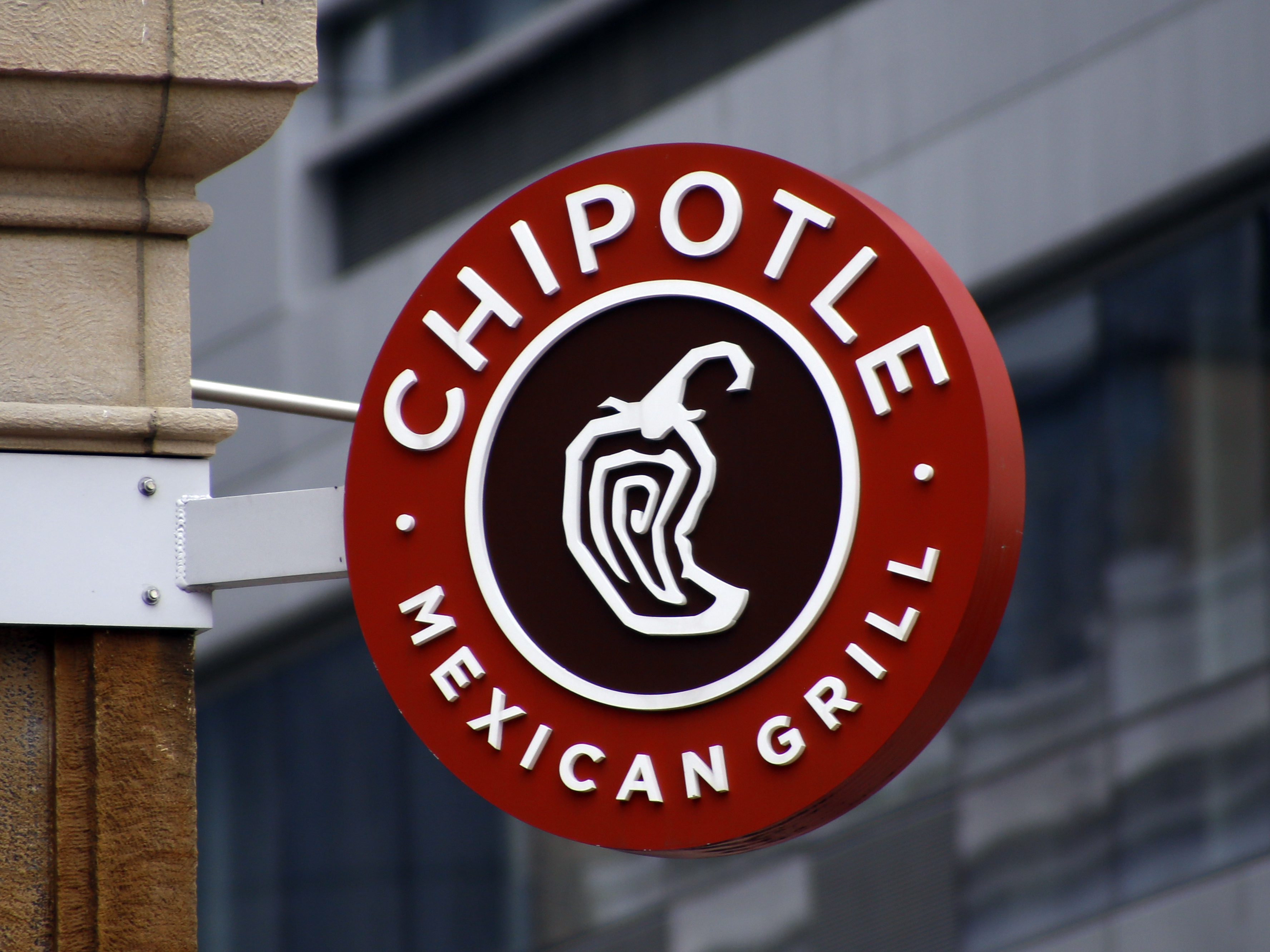 caption: A Chipotle sign hangs outside the chain restaurant in Pittsburgh on Feb. 8, 2016. In June 2022, employees of the Augusta, Maine, Chipotle filed a petition with the National Labor Relations Board asking to hold a union election at the store. The NLRB had scheduled a hearing July 19, 2022. But Chipotle announced the same day it was permanently closing the store.
