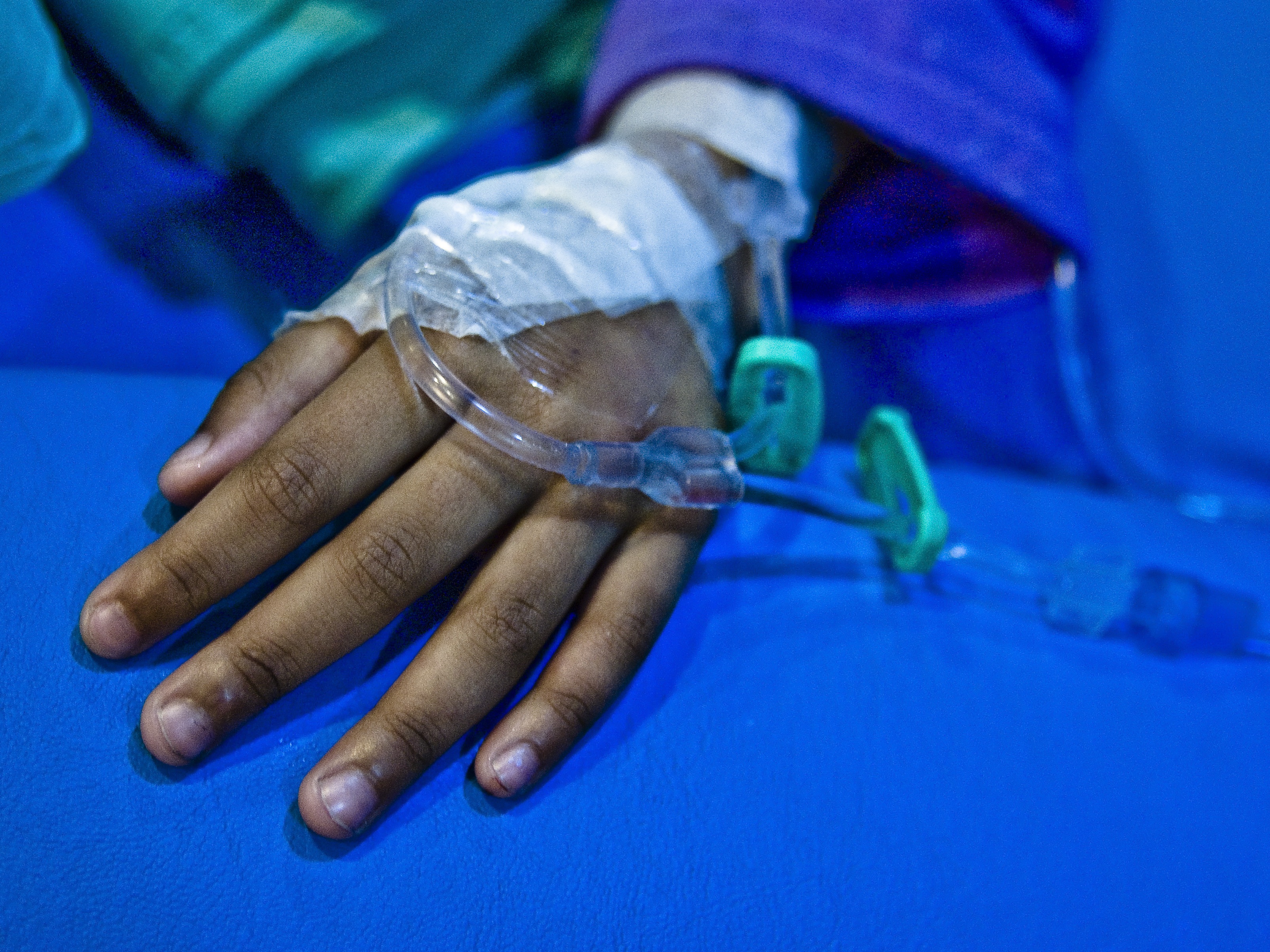 caption: A child undergoing cancer treatment. Countries in the Global South often have far lower survival rates for childhood cancer than in wealthy nations.