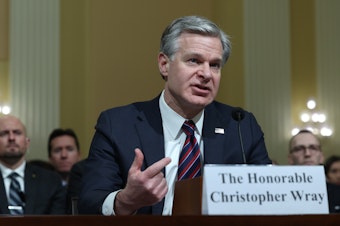 caption: FBI Director Christopher Wray testifies before the House Select Strategic Competition Between the United States and the Chinese Communist Party Committee on Wednesday.