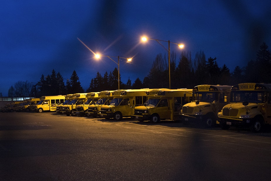 caption: Buses are lined up inside the First Student bus lot on Lake City Way Northeast on Thursday, Feb. 1, 2018, in Seattle. 