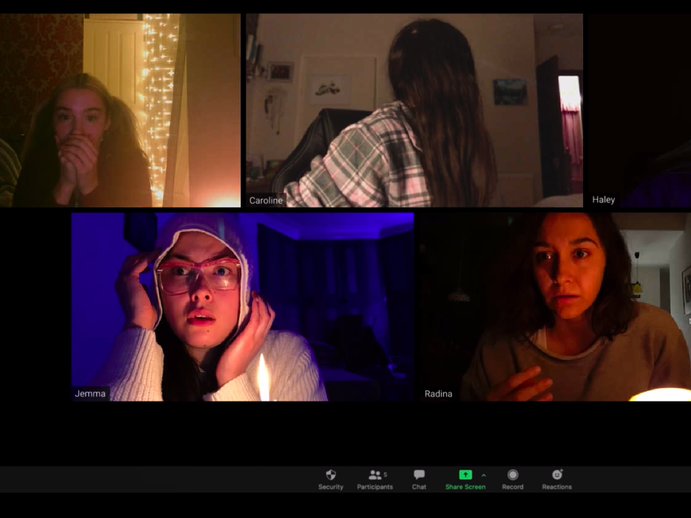 caption: A quarantine seance performed over Zoom goes awry in the new horror movie 'Host,' streaming now on Shudder.