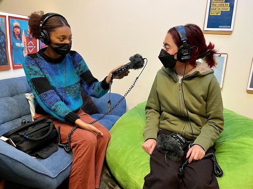caption: Indigo Mays records McKenna Kilayko during an interviewing practice session at KUOW on October 22, 2022.