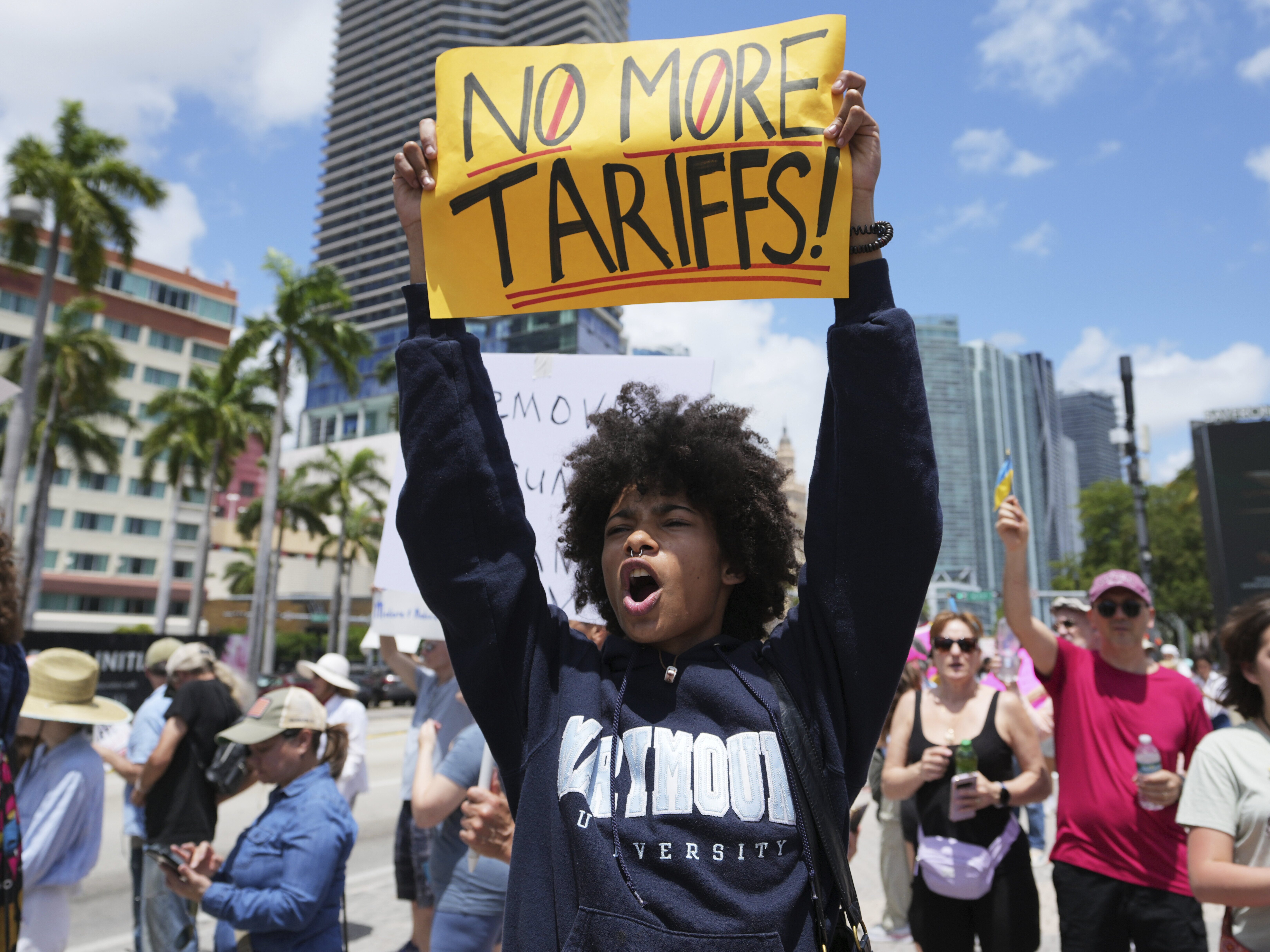 caption: Paul Ivanov chants during a protest against the Trump administration on Saturday in Miami.