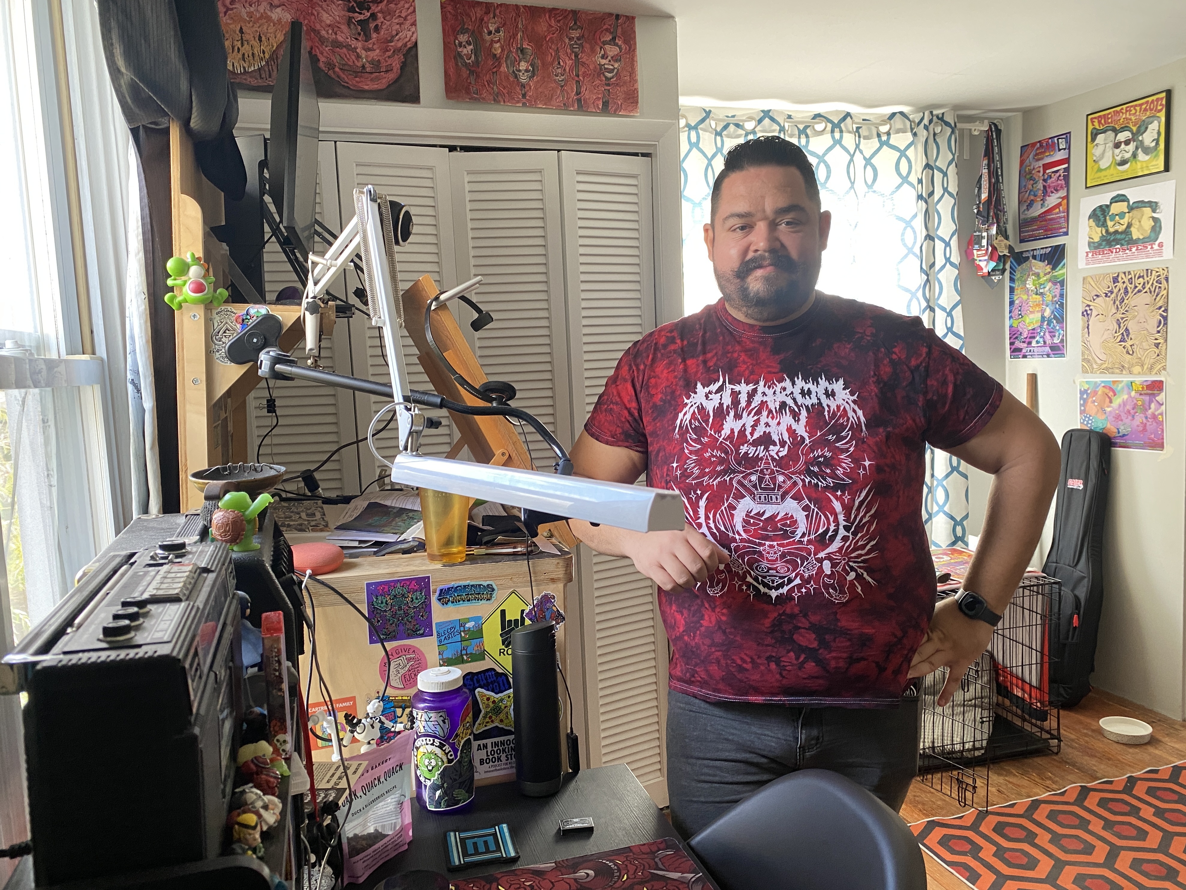 caption: Baltimore illustrator John de Campos isn't happy that AI is being used to create images for commercial purposes, supplanting artists whose real life experience is reflected in their work.