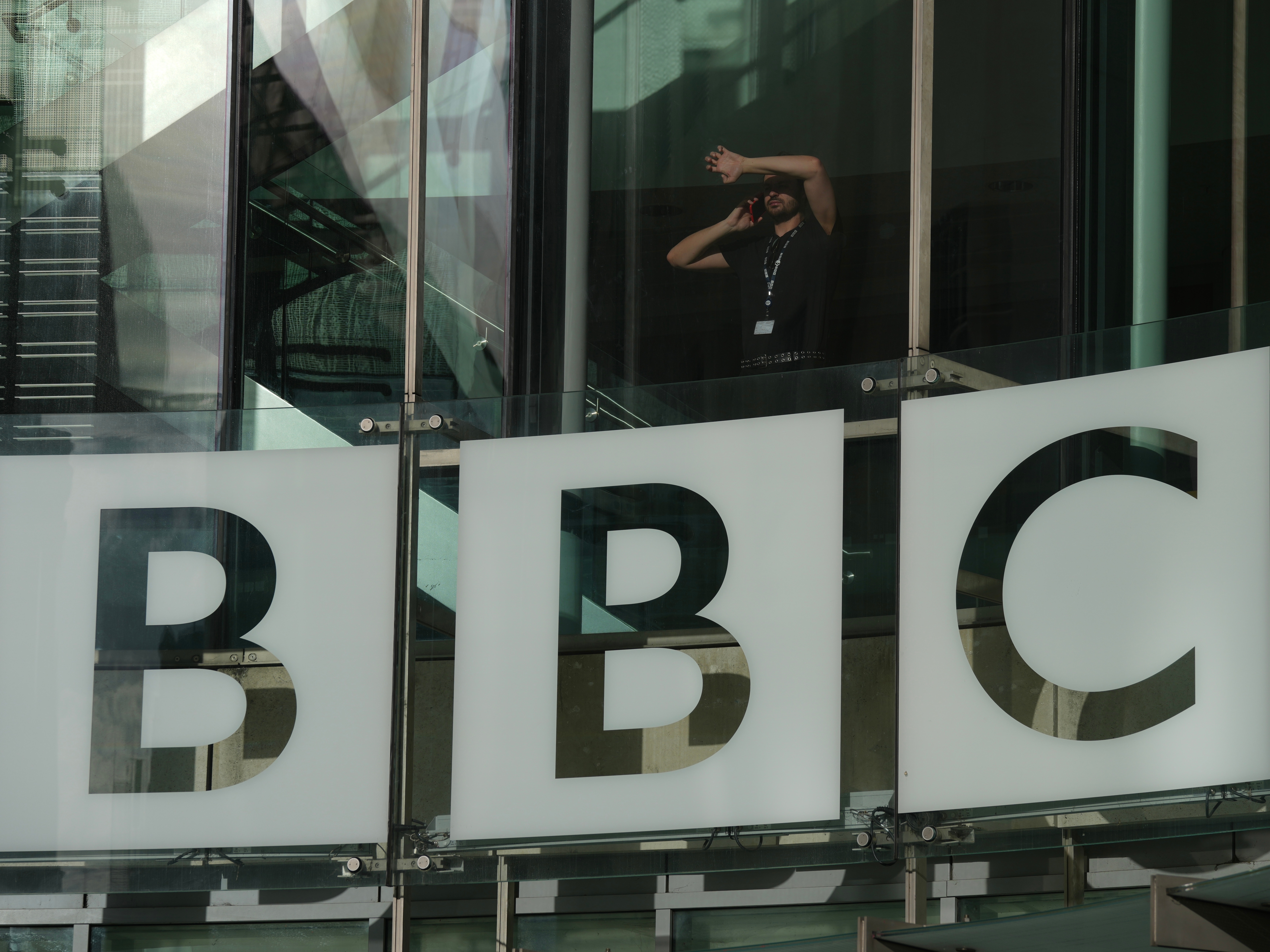 caption: A view of the logo outside the BBC Headquarters in London, Wednesday, Nov. 12, 2025.