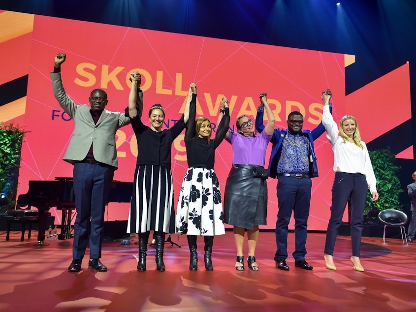caption: Trying to make the world a better place: (left to right) Skoll Award winners Gregory Rockson of mPharma, Nicola Galombik and Maryana Iskander of Harambee Youth Employment Accelerator, Nancy Lublin of Crisis Text Line, Bright Simons of mPedigree and Julie Cordua of Thorn.