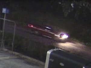 caption: An image taken from surveillance video of a pickup whose driver, according to authorities, fired several shots into a car carrying a family near Houston, killing a 7-year-old girl.