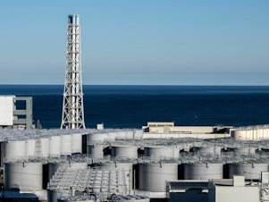 caption: Storage tanks for contaminated water at the Fukushima Daiichi nuclear power plant are near capacity.