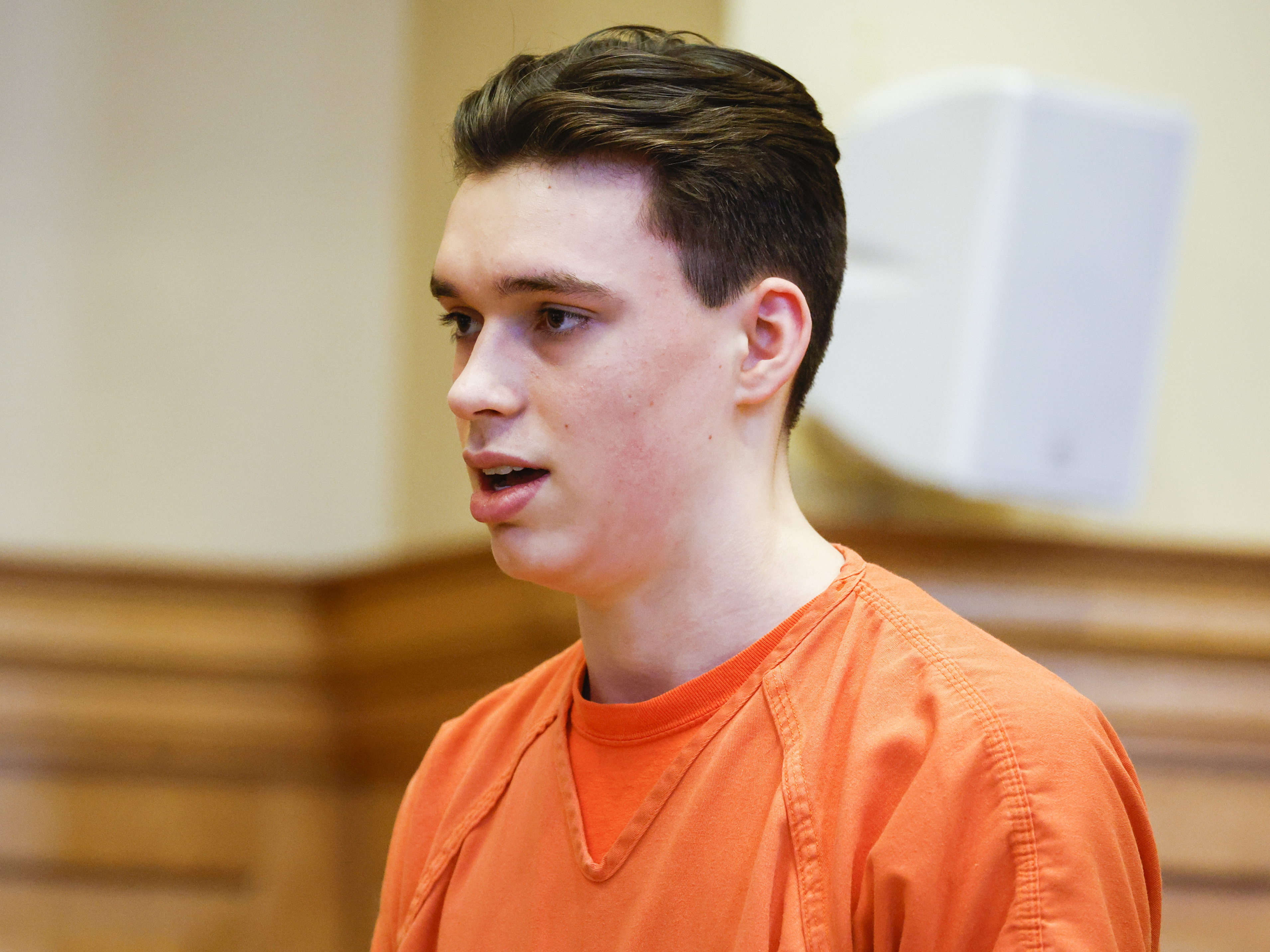 caption: Willard Miller makes a statement during his sentence hearing at the Jefferson County Courthouse in Fairfield, Iowa, Thursday, July 6, 2023. Miller, the first of two Iowa teenagers who pleaded guilty to beating their high school Spanish teacher to death with a baseball bat, was sentenced Thursday to life with a possibility of parole after 35 years in prison.