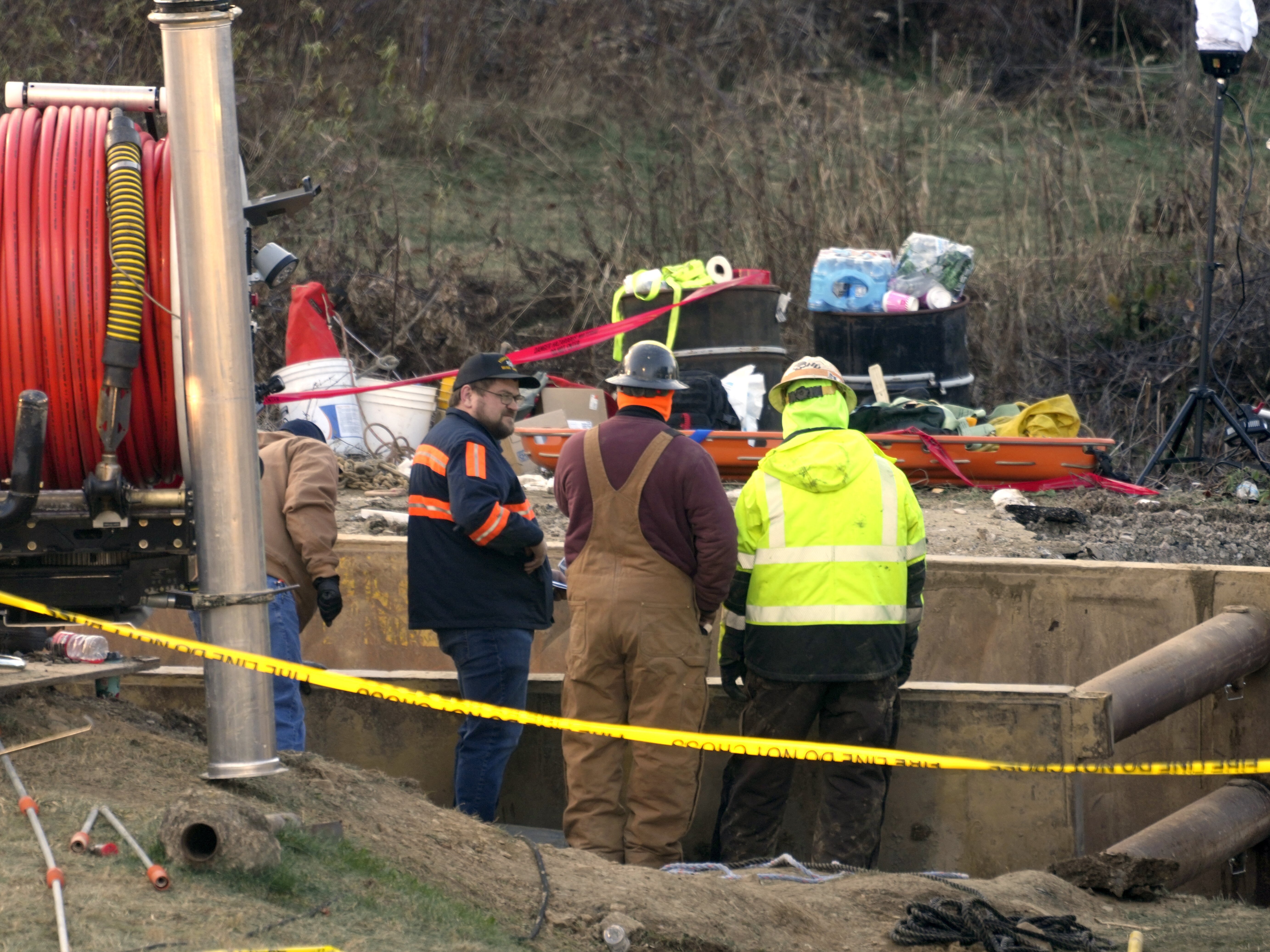 caption: Rescue workers continue to search on Wednesday for Elizabeth Pollard, who is believed to have disappeared in a sinkhole while looking for her cat, in Marguerite, Pa.