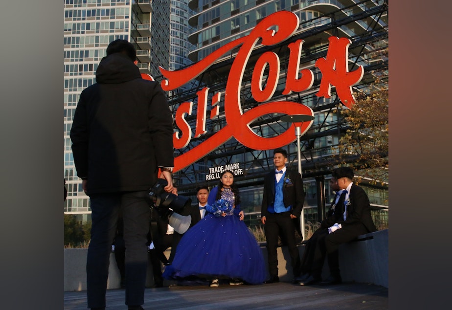 caption: A young woman celebrates her fifteenth birthday on the waterfront in Queens