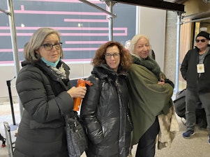 caption: Courtroom sketch artists Elizabeth Williams (from left), Jane Rosenberg and Christine Cornell wait to enter the Manhattan courthouse where former President Donald Trump's trial is occurring on April 25.