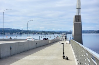 caption: An electric scooter on the Highway 520 bike path on Wednesday, October 4, 2023.