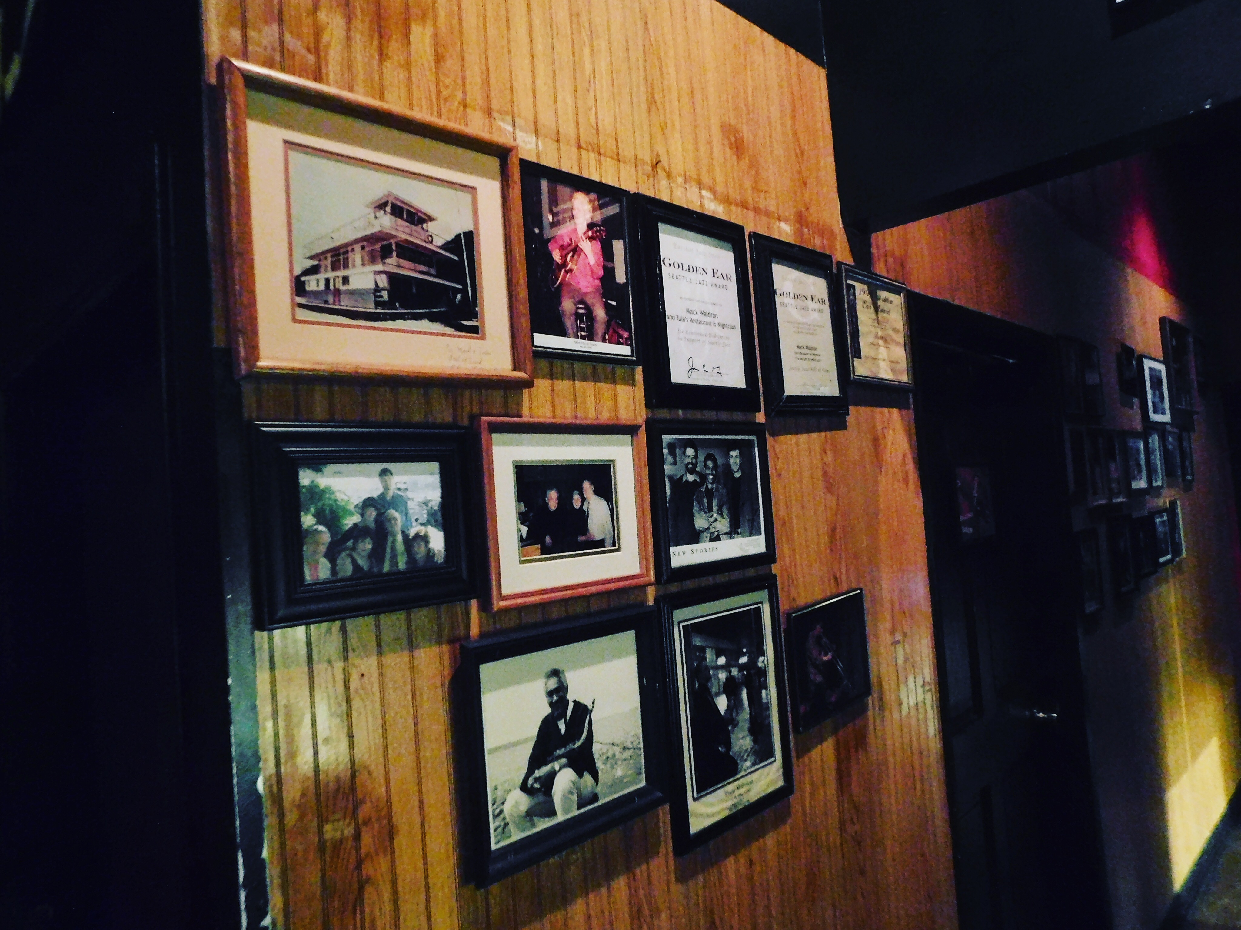 caption: Photo's of past performers in Tula's space 