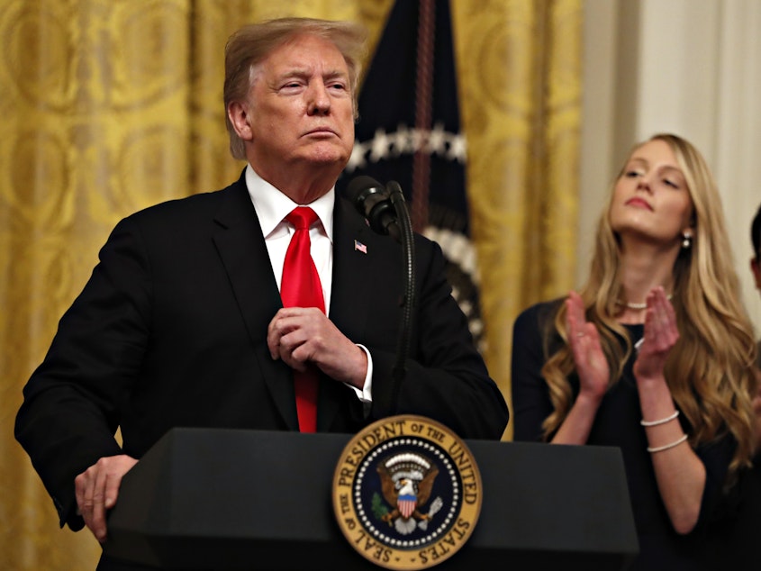 caption: President Trump speaks before signing an executive order Thursday requiring colleges to certify that their policies support free speech as a condition of receiving federal research grants.