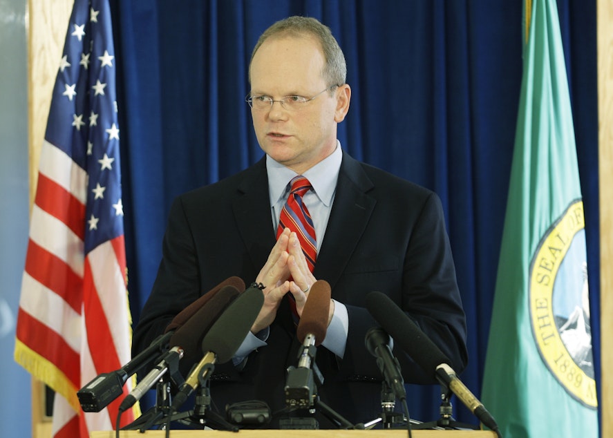 caption: In this file photo, King County Prosecutor Dan Satterberg talks to reporters at a press conference in 2009.
