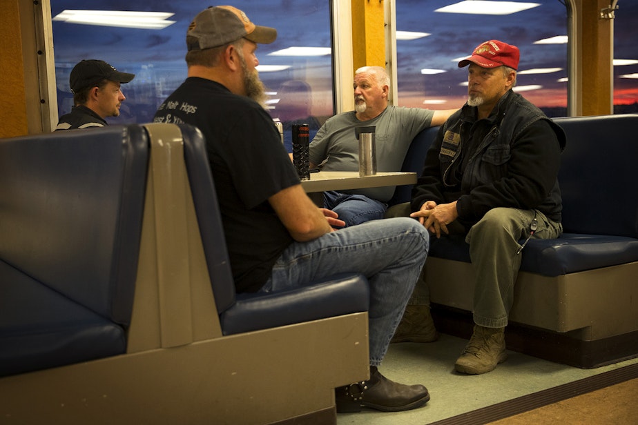 caption: From left, Jesse Lee-Welsh, Tim Radebaugh, Wayne Hegg and Joe Anthony ride the ferry together on Wednesday, June 12, 2019, from Southworth to the Fauntleroy ferry terminal in Seattle. The group, who met on the ferry four years ago, sit together every morning on their way to work. 