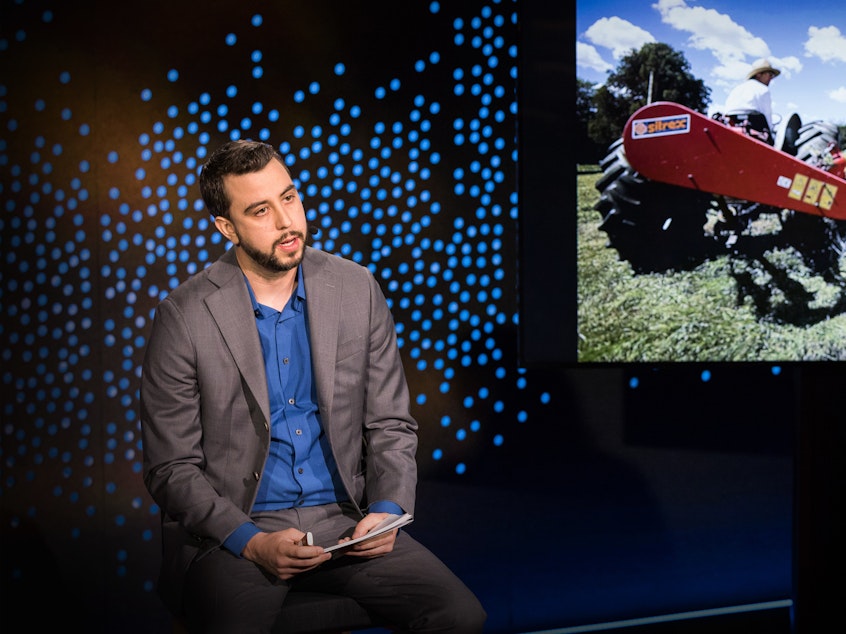 caption: Drew Philp on the TED stage.