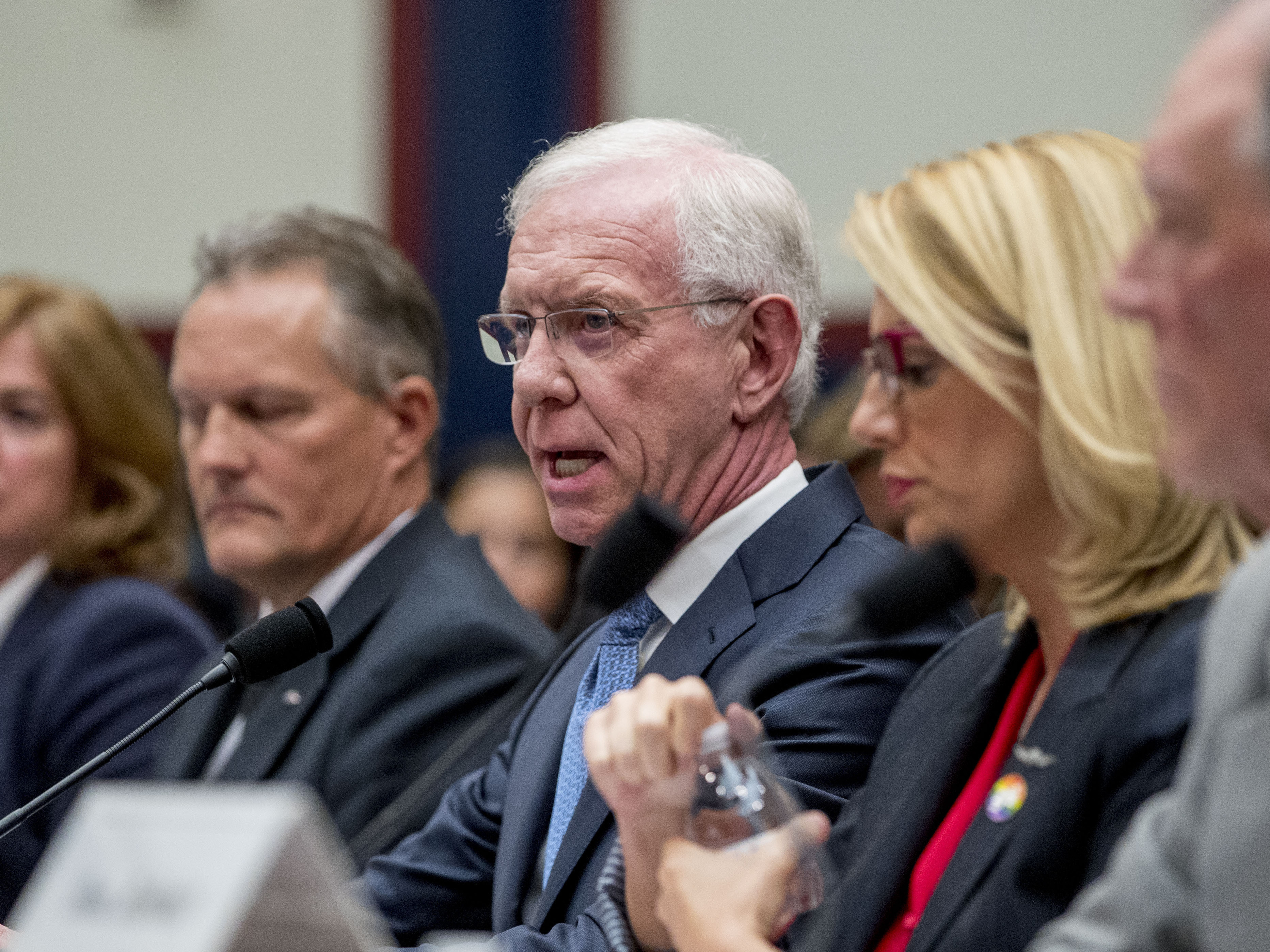 caption: Capt. Chesley "Sully" Sullenberger, accompanied by other pilots and former FAA administrator Randy Babbitt, speaks during a House Committee on Transportation and Infrastructure hearing on the status of the Boeing 737 Max in Washington, D.C.