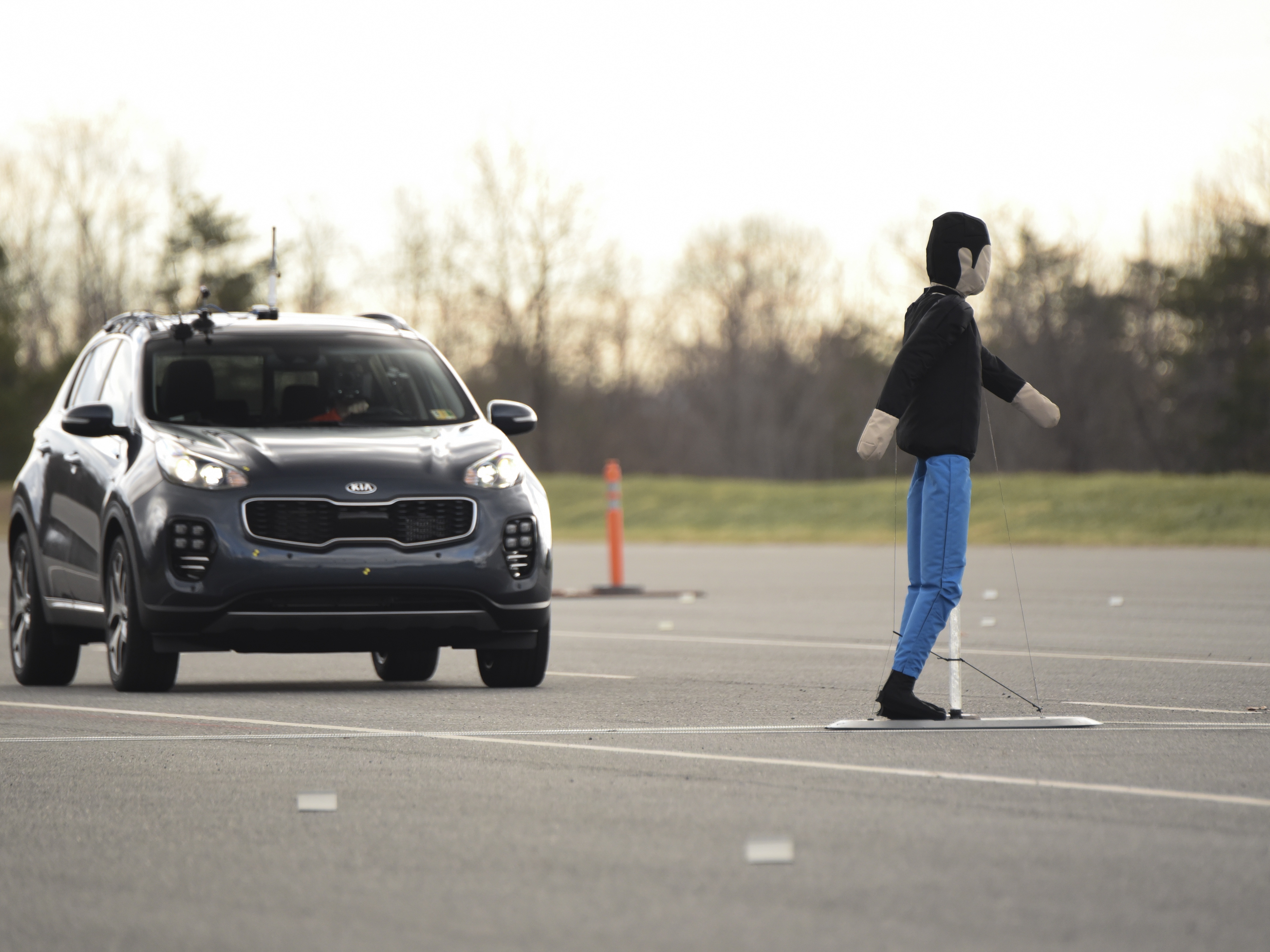 caption: Researchers at the Insurance Institute for Highway Safety test how well automatic emergency braking systems work in real-world conditions.