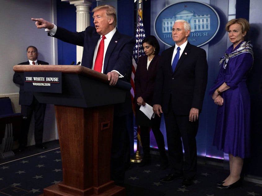 caption: President Trump speaks to reporters at a briefing on Wednesday.