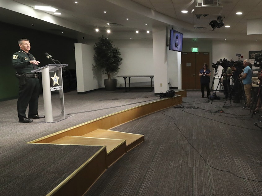 caption: Orange County Sheriff John Mina holds a press conference about Wednesday's shootings in Orlando.