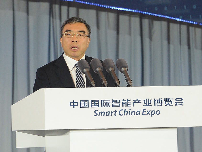 caption: Huawei Chairman Liang Hua speaks during the Big Data and Smart Technology Summit of the Smart China Expo in Chongqing, China, in 2018. On Tuesday, Liang said Huawei is willing to sign a "no-spy agreement" to reassure U.S. leaders who worry the company's technology could be used for surveillance.