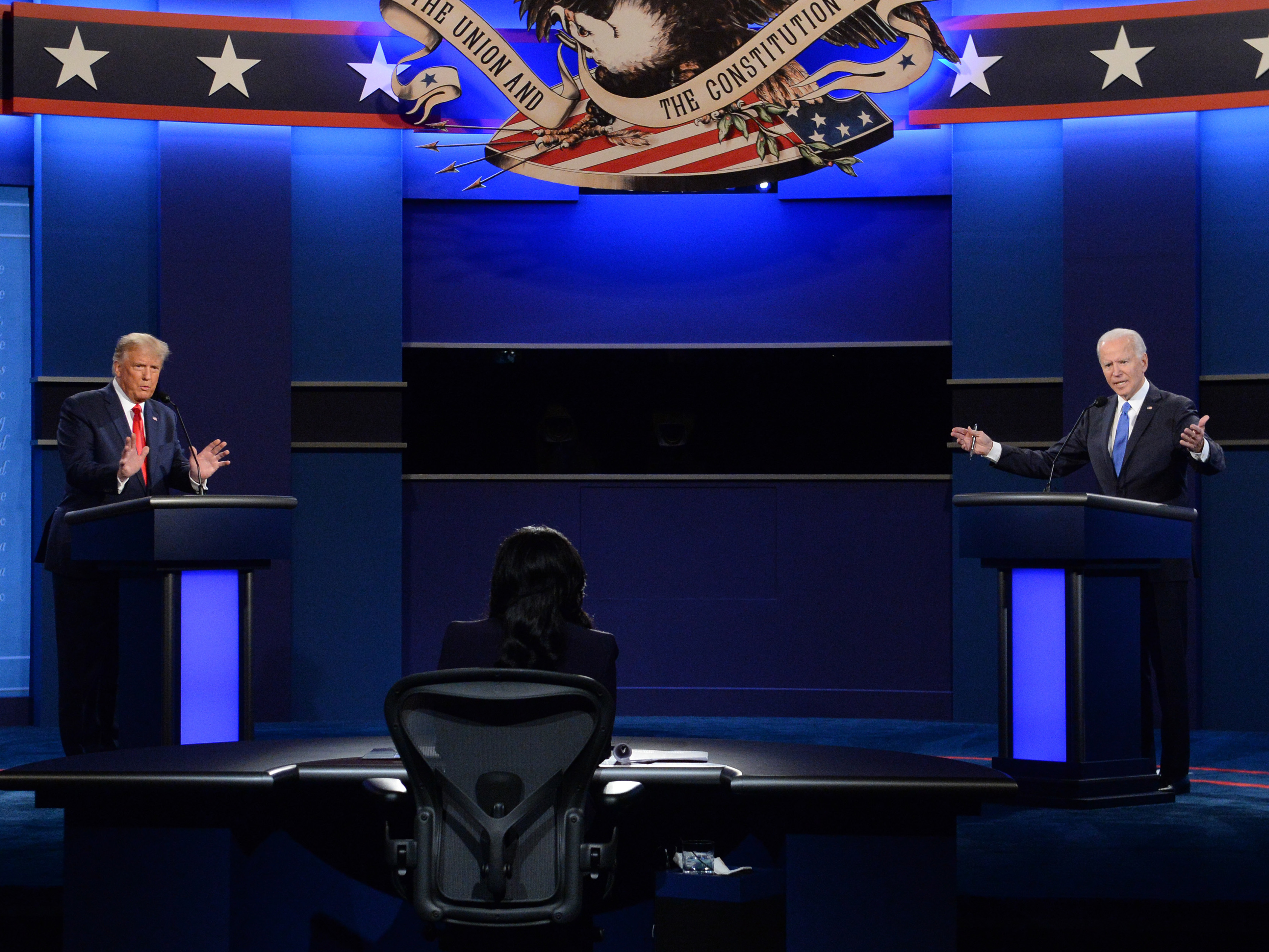 caption: Joe Biden, the then-2020 Democratic presidential nominee, right, and President Trump speak during the Oct. 22, 2020 presidential debate at Belmont University in Nashville, Tennessee