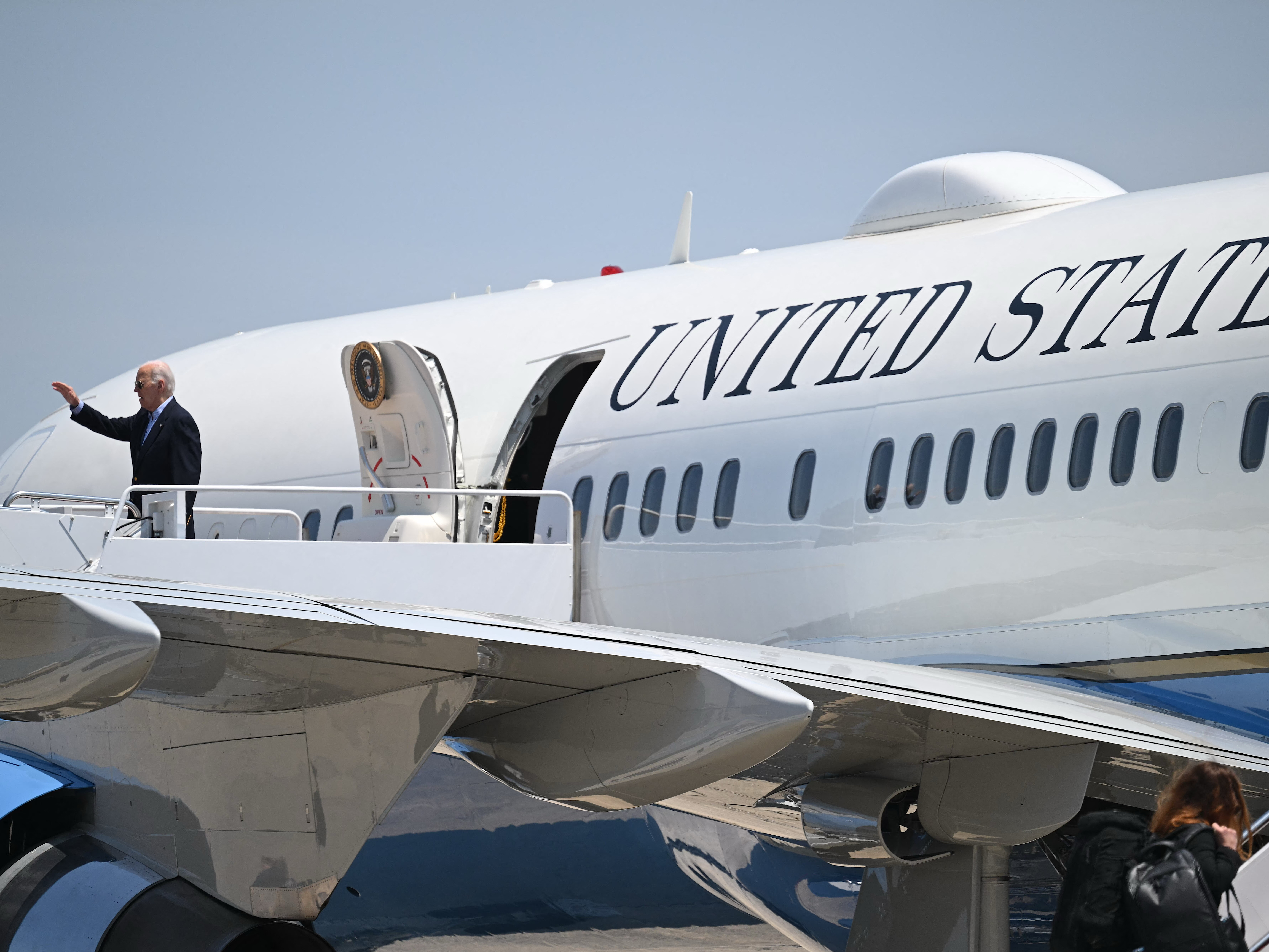caption: President Biden boards Air Force One on July 5 to campaign in Madison, Wis. — where he'll also do a high-stakes television interview with ABC News.