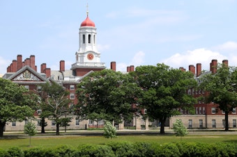 caption: Harvard University, shown here, and the Massachusetts Institute of Technology sued the Trump administration over a rule change that would have barred international college students from taking online course loads in the U.S. In court on Tuesday, a judge announced the government would rescind the directive.