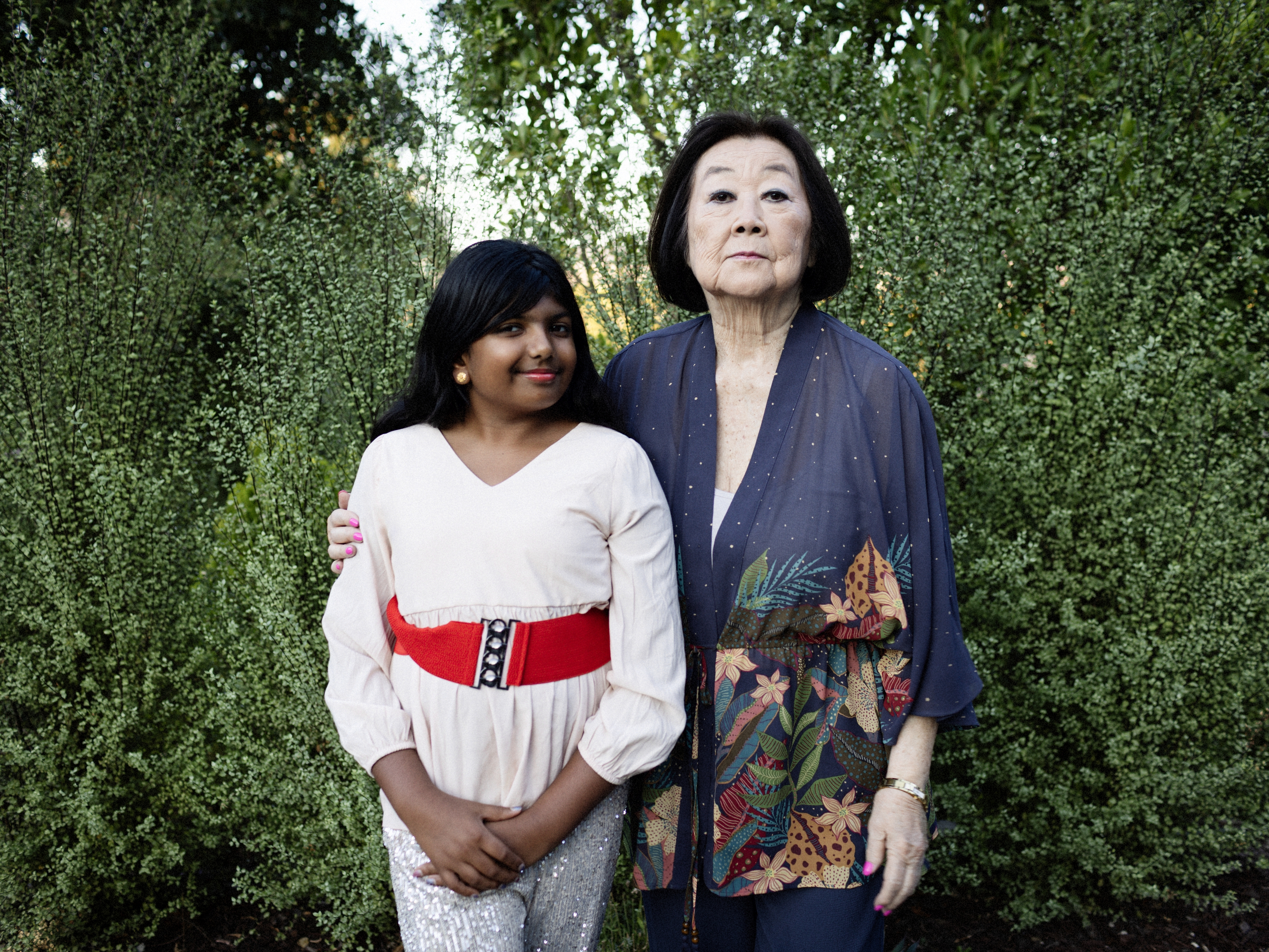 caption: Ameya Desai poses with Linda Horikawa, an 85-year-old grandmother who is the subject of this year's winning middle school entry in NPR's Student Podcast Challenge.