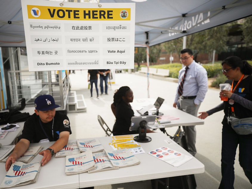 caption: California holds early voting at a new L.A. County "Mobile Vote Center" on Feb. 27 in Los Angeles. The state's presidential primary is on Super Tuesday, March 3.
