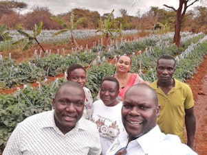 caption: Noah Nasiali-Kadima, foreground, takes a selfie with members of the Africa Farmers Group during a tour of a member's farm in Machakos County, Kenya.
