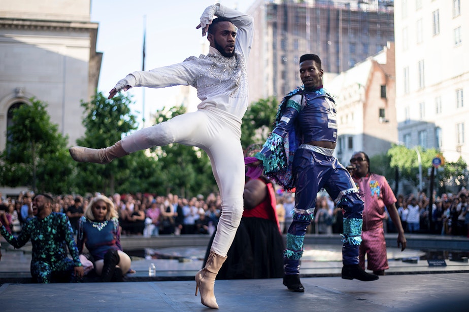 caption: Performers compete during the "Battle of the Legends" vogueing competition outside of the Metropolitan Museum of Art on June 11, 2019 in New York City. (Johannes Eisele/AFP via Getty Images)