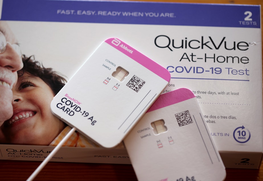 caption: At-home tests are becoming increasingly difficult to find despite manufacturers boosting production as COVID-19 cases rise in schools and employers increase monitoring.