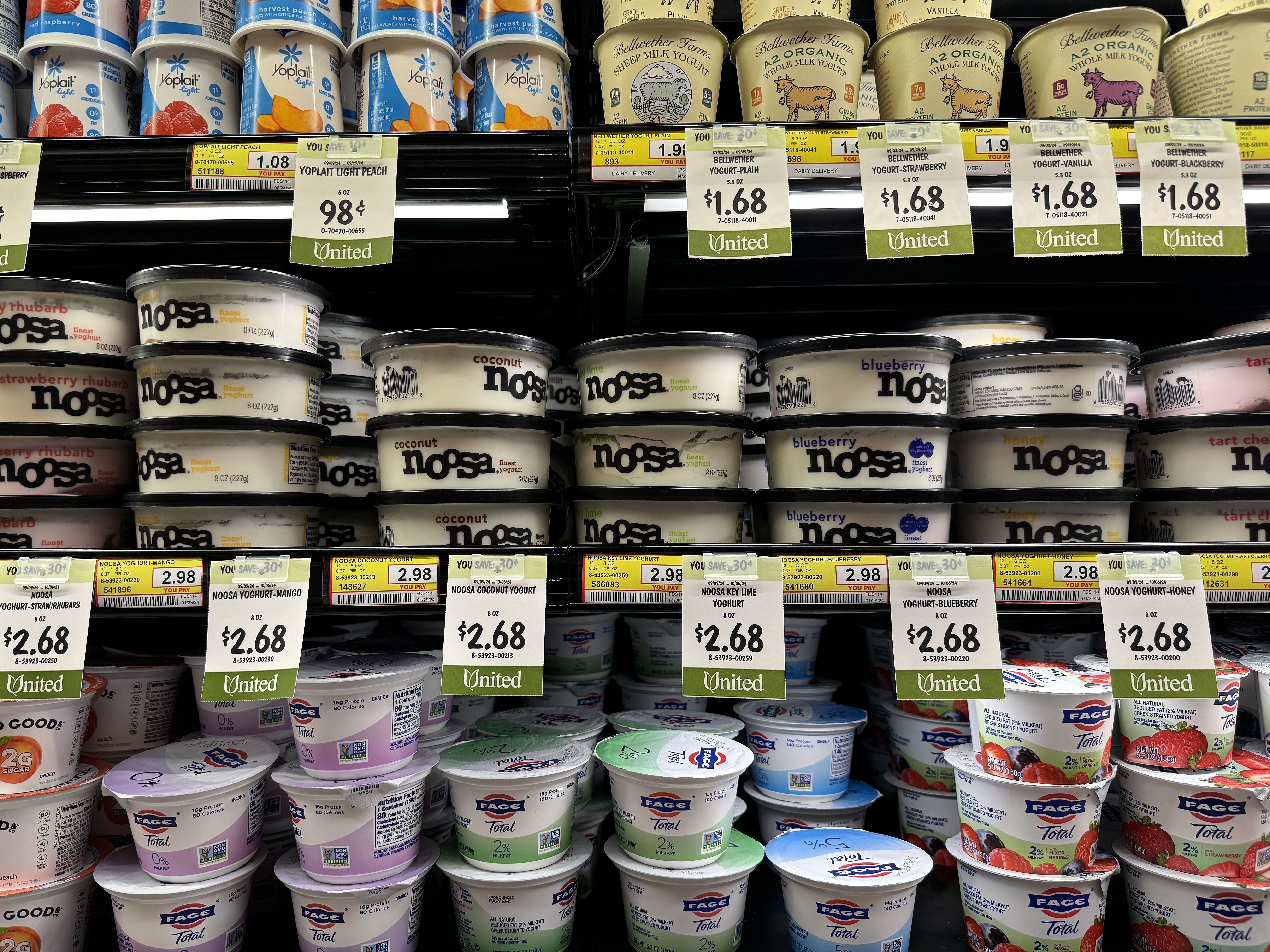 caption: Grocery prices aren't rising as fast anymore, but Americans are still dealing with high prices. Seen here are dairy items for sale in San Rafael, Calif., in September.