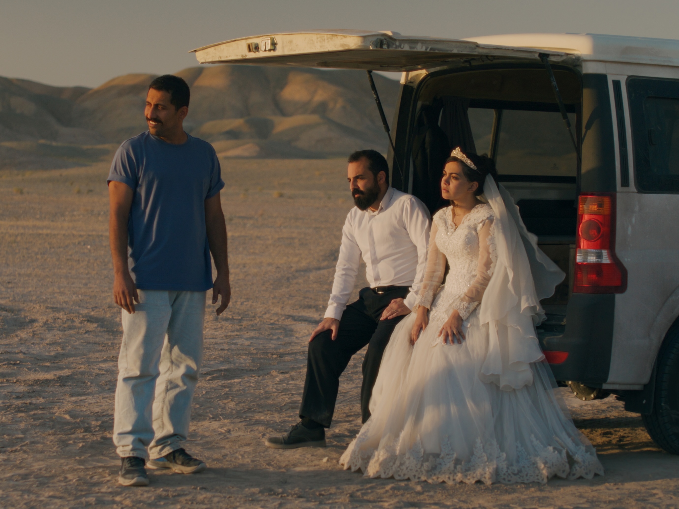 caption: Jafar Panahi's shockingly funny new revenge thriller was informed by the stories of people he met in prison. Above, Mohamad Ali Elyasmehr, Majid Panahi and Hadis Pakbaten in <em>It Was Just an Accident.</em>