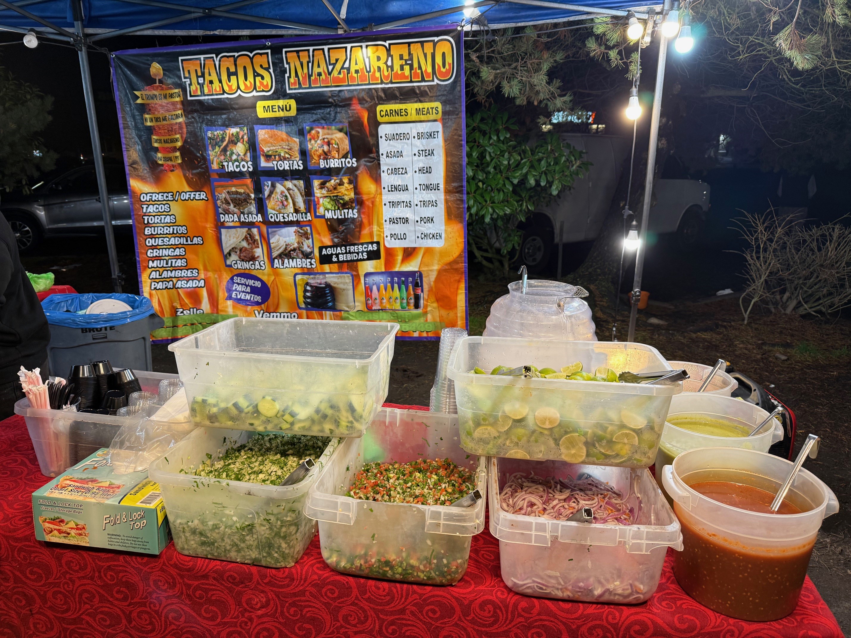 caption: An unpermitted food cart, photographed Dec. 11, 2025, during a joint night out with health inspectors and Everett Police. The health department issued seven cease-and-desist orders that night.