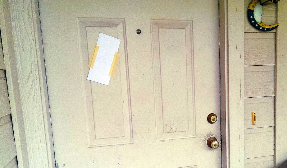 caption: A posted notice to evict.