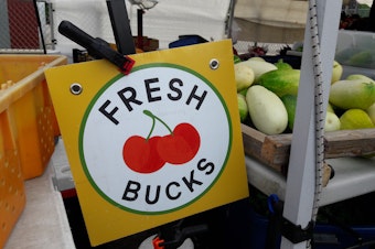 caption: The Fresh Bucks program helps low-income families stretch their food stamp benefits and buy fresh produce at Seattle farmer's markets. 